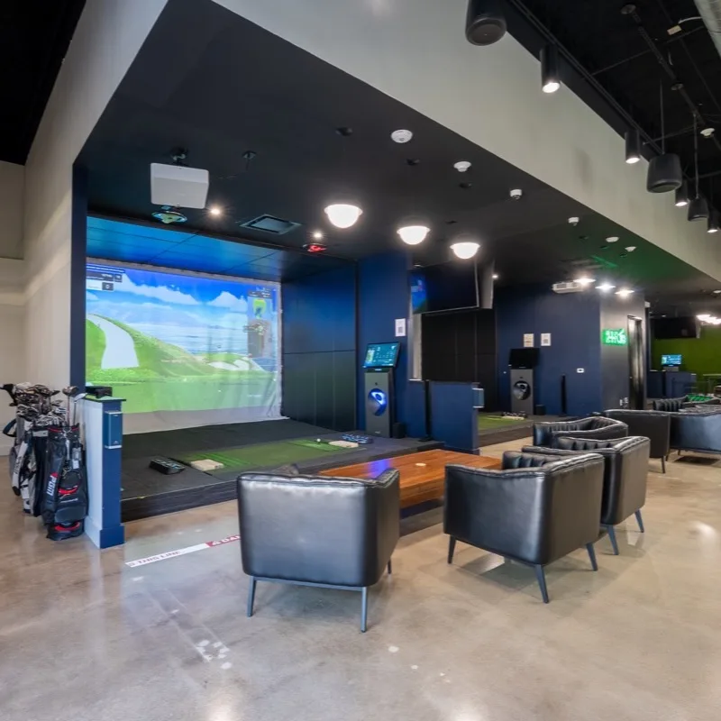 A Golfzon NX bay and lounge seating at 2-1-Fore Golf, Richardson, Texas
